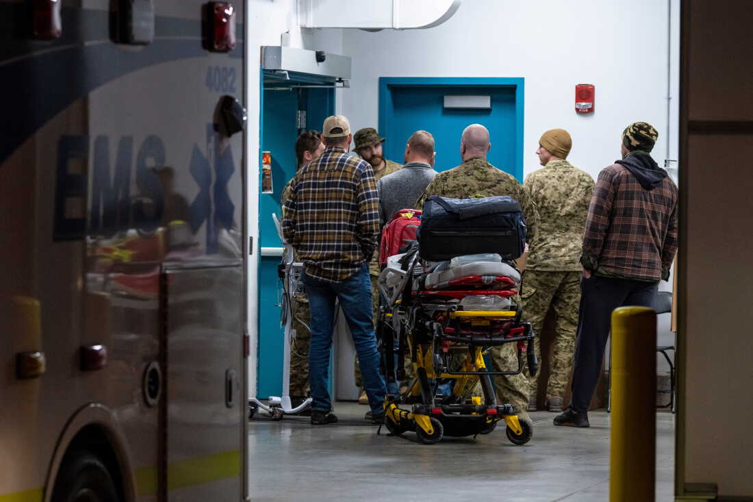 Emergency crews and military personnel are seen at the Wainwright Health Centre as injured military members are treated after a fire at Canadian Forces Base Wainwright, outside of Wainwright, Alberta Saturday, Oct. 17, 2026.