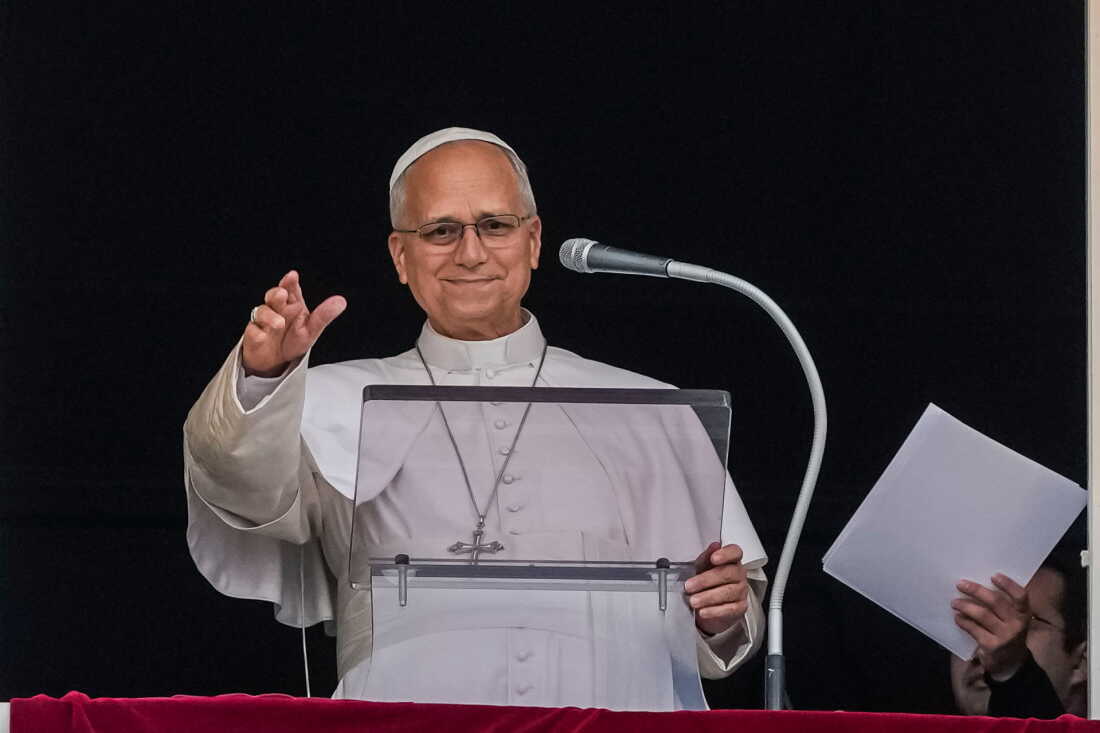 Pope Leo XIV appears at the window of his study in the Apostolic Palace overlooking St. Peter's Square at the Vatican for the traditional noon blessing after praying the Angelus, Sunday, Oct. 18, 2026, a day after he returned from the hospital, where he had lung cancer removed on Tuesday.