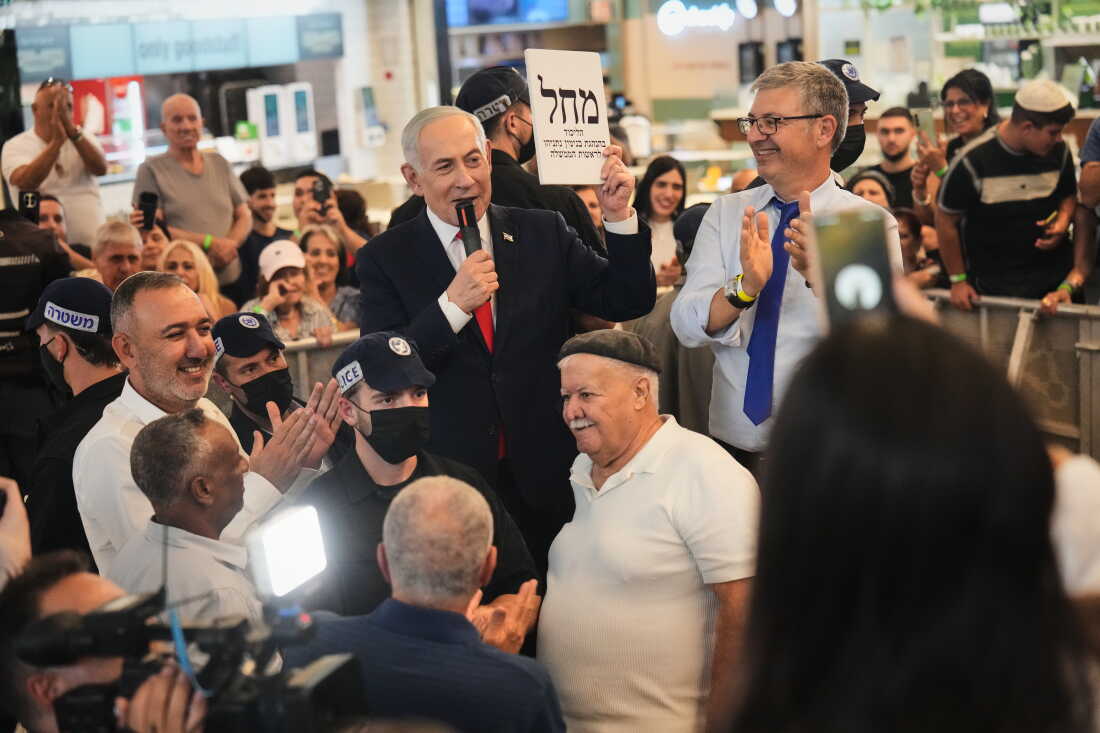 Israeli Prime Minister Benjamin Netanyahu, leader of the Likud party, speaks with supporters while he campaigns ahead of the country's general election at a shopping mall in Ramla, Israel, Monday, Oct. 19, 2026.