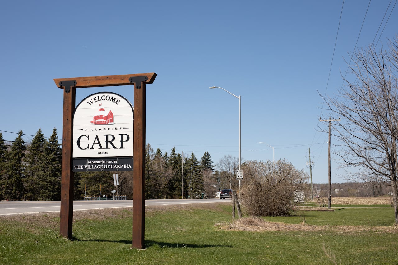 A sign reading Welcome to the Village of Carp