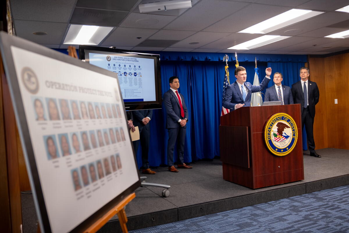 An official speaks at a lectern 