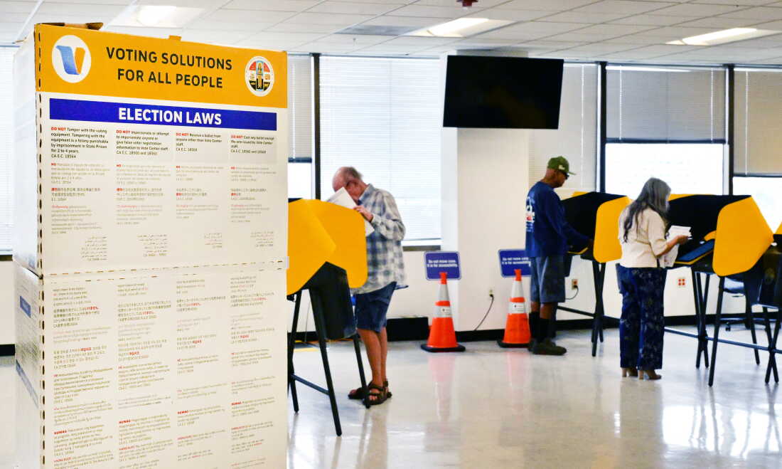 People vote in Norwalk, Calif., during early voting in California's primary election on June 1, 2026. The Department of Justice has charged 28 green card holders in the state for allegedly illegally registering to vote or voting in U.S. elections, in an escalation of a feud with California officials over the state’s voting system.
