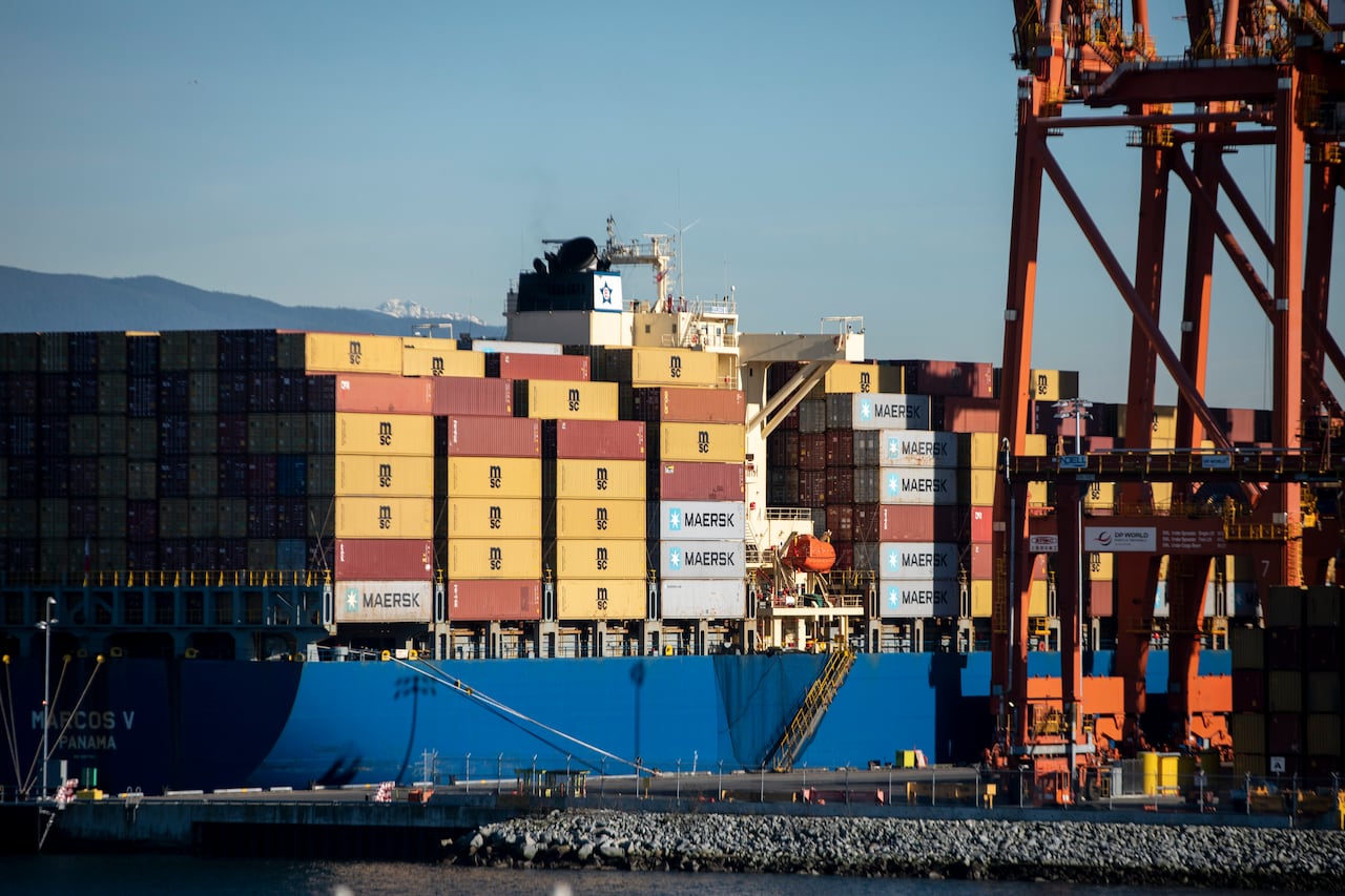 A giant cargo ship full of shipping containers.