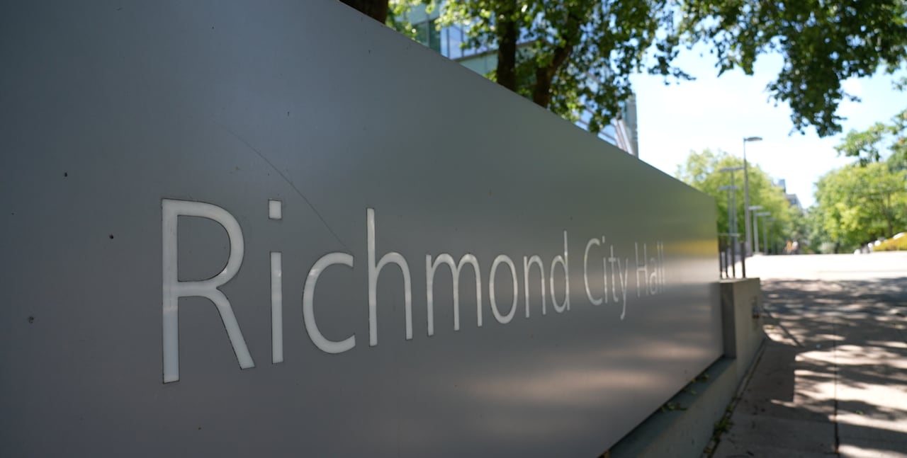 A large sign outside city hall reading RICHMOND CITY HALL