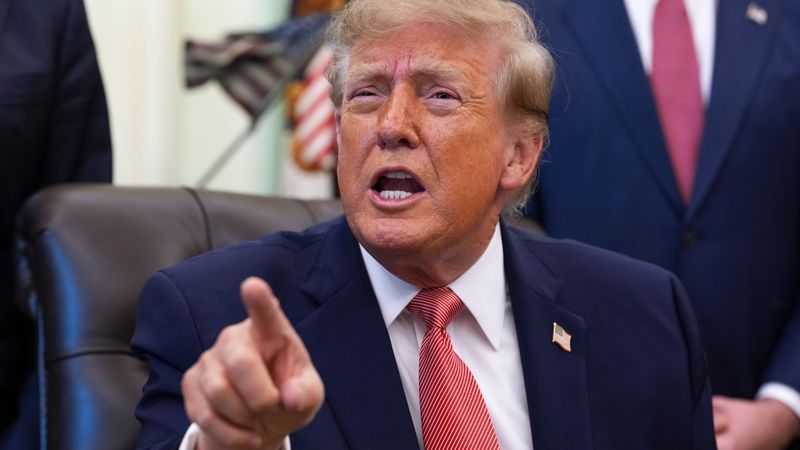 WASHINGTON, DC - OCTOBER 20: U.S. President Donald Trump gestures to reporters during an event in the Oval Office of the White House on October 20, 2026 in Washington, DC. Trump and Vance announced a new $25 million dollar federal Fraud Whistle Blower Incentive Program with the Department of Justice to pay up to $30,000 to citizens who give verified tips that lead to a conviction or major enforcement action. (Photo by Andrew Harnik/Getty Images)