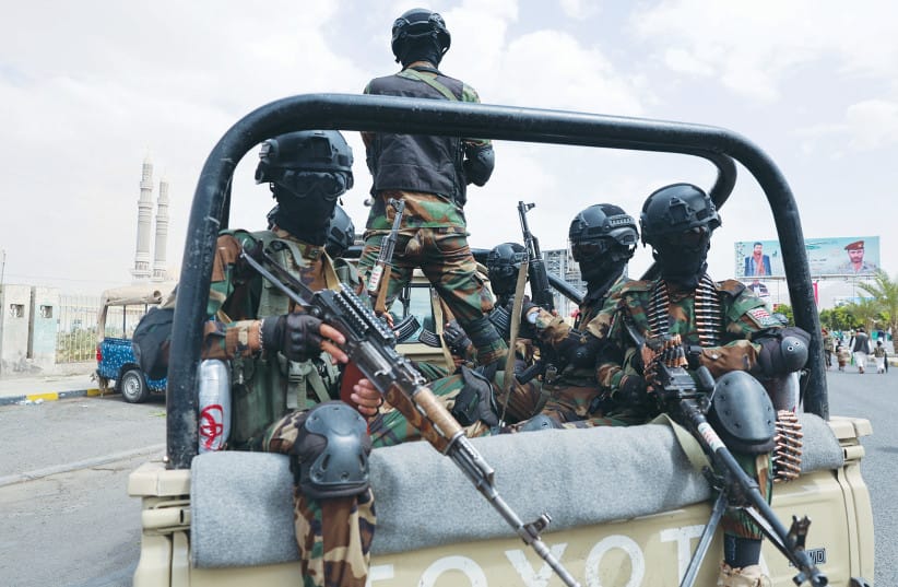 MEMBERS OF Houthi security forces patrol the site of a demonstration, attended by predominantly Houthi-supporting protesters, in solidarity with Palestinians, in Sanaa, Yemen, on July 11.