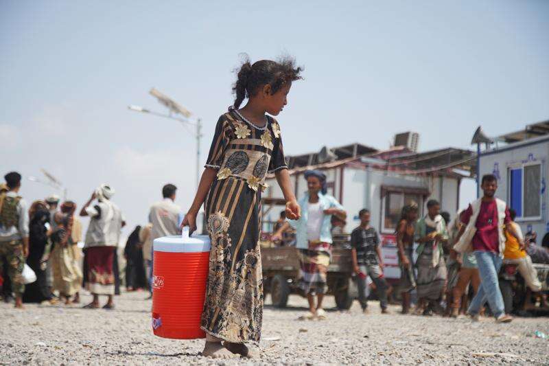 A displaced Yemeni girl walks at Al-Firdaws 2 camp in Ras Imran, on the western outskirts of Aden, Yemen, Yemen, Tuesday, Oct. 20, 2026. (AP Photo/Abdulnasser Alseddik)