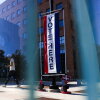 People walk by a polling place at Denver's Central Library on June 30, 2026.