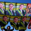 A street vendor sells campaign flags of presidential candidates Sen. Flavio Bolsonaro and current President Luiz Inacio Lula da Silva who is running for reelection in Brasilia, Brazil, Tuesday, Sept. 29, 2026.