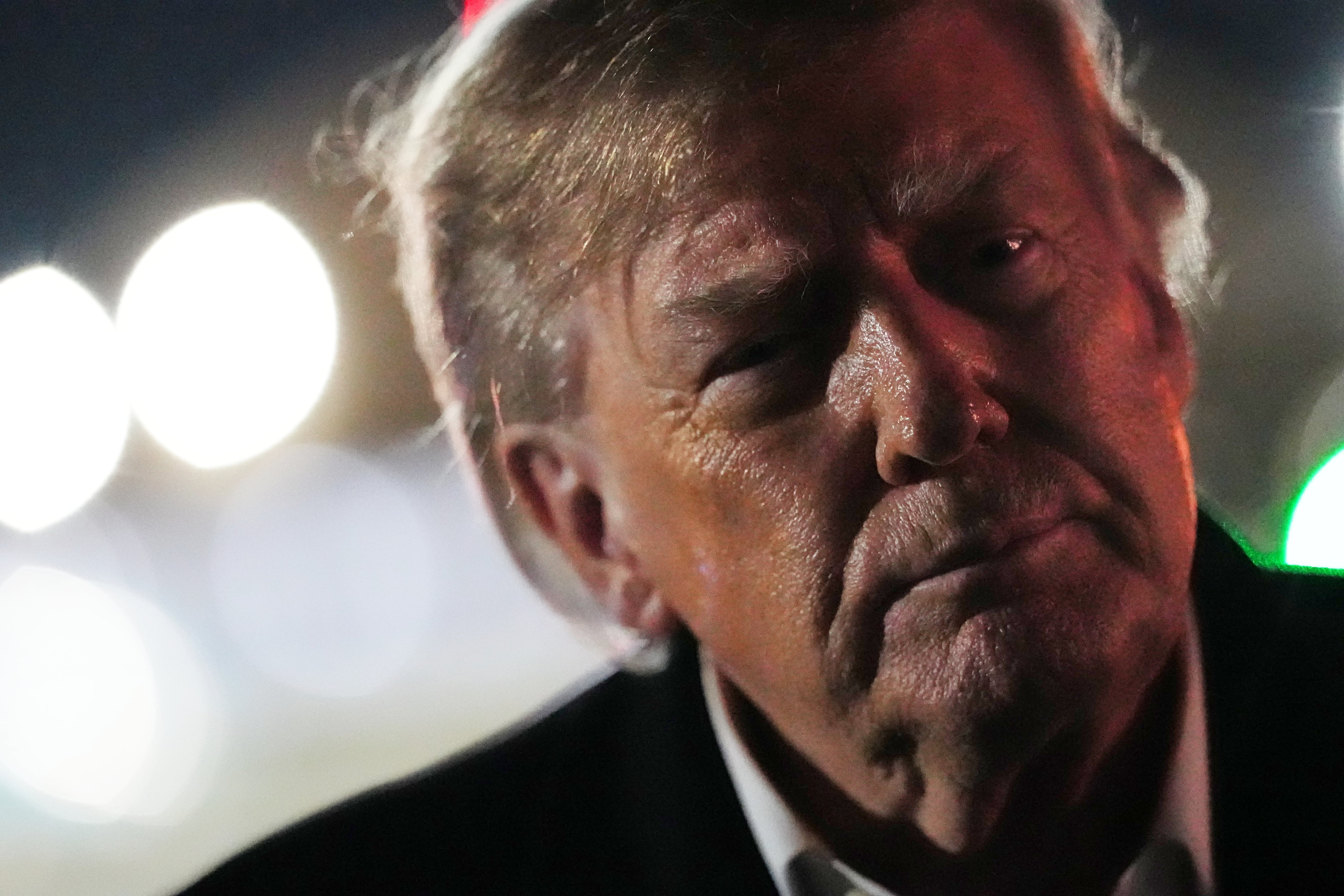 Donald Trump speaks to reporters after arriving on Air Force One