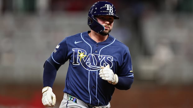 It started with hockey, then he picked up a bat. Meet the Toronto catcher headed to the World Series