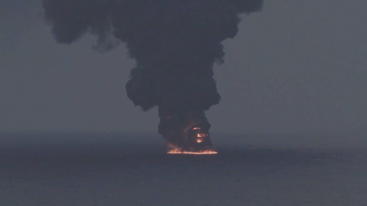 Smoke rises from a burning vessel, following what the US Central Command said was a strike on an Iranian-affiliated dhow, at a location given as the Gulf of Oman, in this still image taken from a handout video released October 14, 2026.