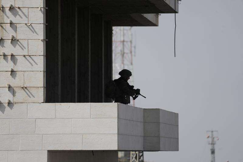 Israeli soldiers take up positions during an army operation in the West Bank city of Hebron Saturday, Oct. 24, 2026. A day after a Palestinian shooting attack in the area. (AP Photo/Mahmoud Illean)