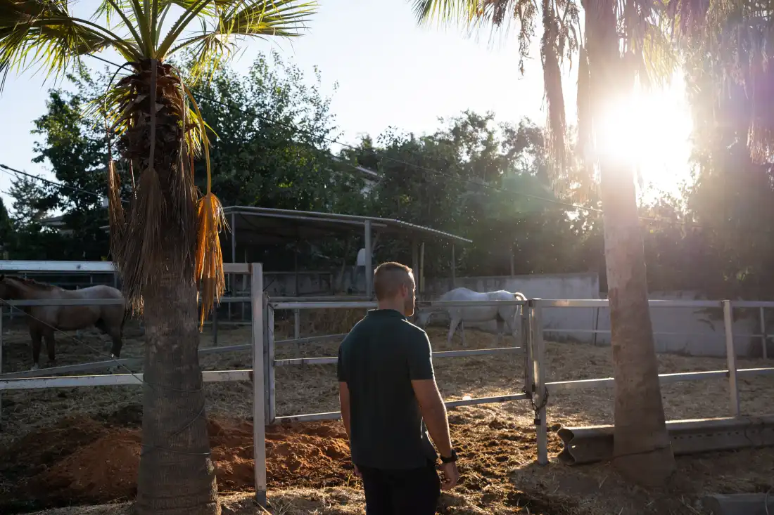 Lior, 34, an Israeli reservist soldier who commanded a sniper unit during wars in Gaza and Lebanon, poses for a portrait at a farm in Udim, Israel where he plans to launch a horse therapy program for veterans with post traumatic stress disorder.