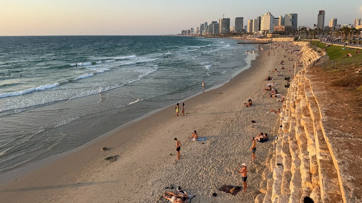 Two beaches, just miles apart, show how different daily life is in Israel and Gaza