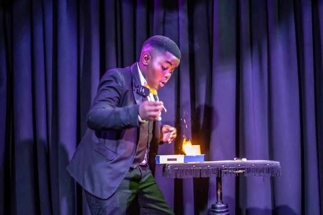 Lubelo Mthenjana performs a magic trick involving fire during the annual junior magic contest at the College of Magic in Cape Town, South Africa.