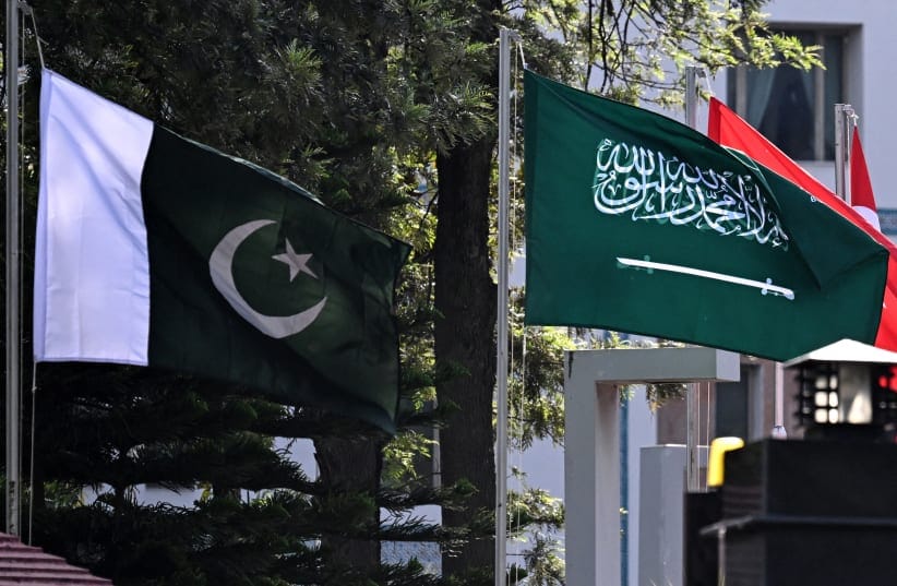 National flags of Pakistan (L) and Saudi Arabia flutter at Pakistan's Ministry of Foreign Affairs premises in Islamabad on March 29, 2026. Foreign ministers from Pakistan, Saudi Arabia, Egypt and Turkey met on March 29 for talks on the war in the Middle East, with Islamabad acting as a go-between fo