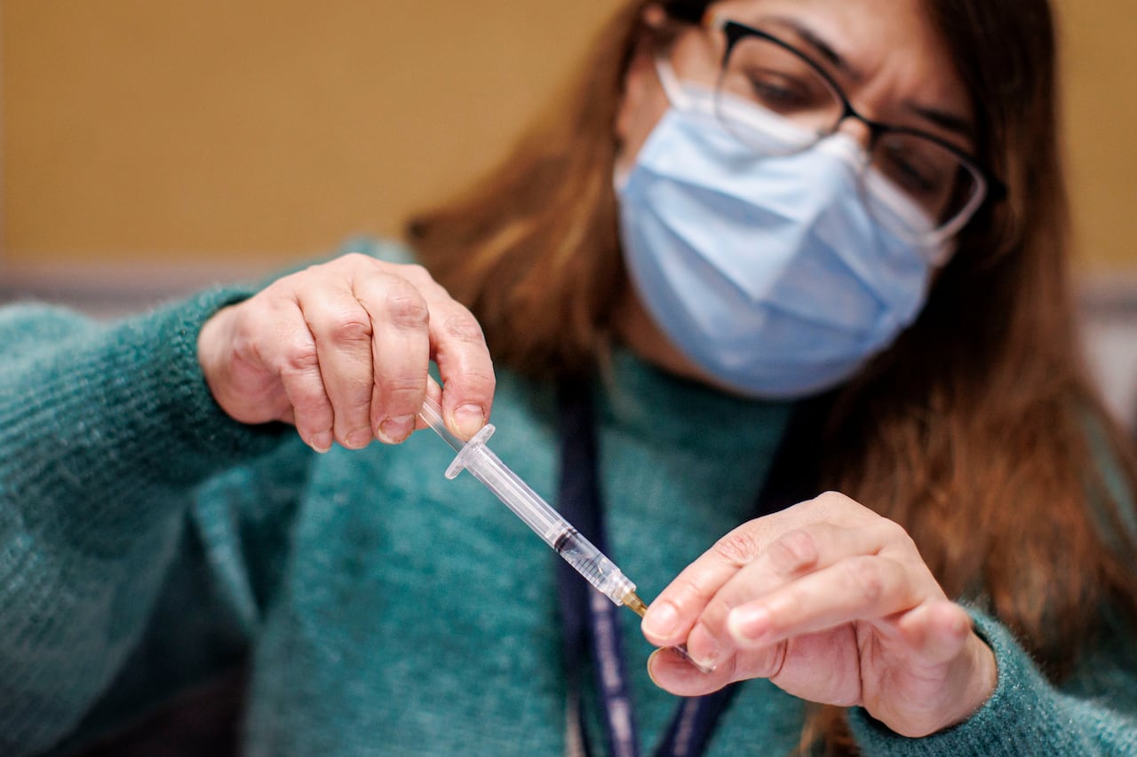 A Toronto Public Health nurse provides vaccinations at a clinic at the North York Civic Centre on Jan. 25, 2024.