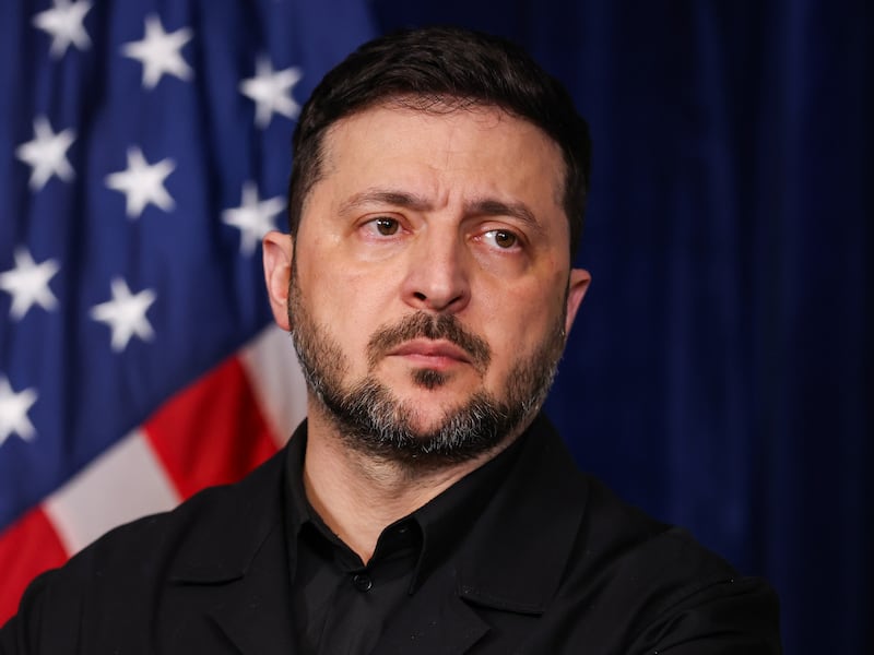 Ukrainian President Volodymyr Zelensky listens during a press conference with U.S. President Donald Trump following their meeting at Trump’s Mar-a-Lago club on December 28, 2025 in Palm Beach, Florida.