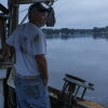 Bill Scerbo, a commercial crabber, works a morning shift on Saturday, June 14, 2025, in Shady Side, MD. (KT Kanazawich for NPR)