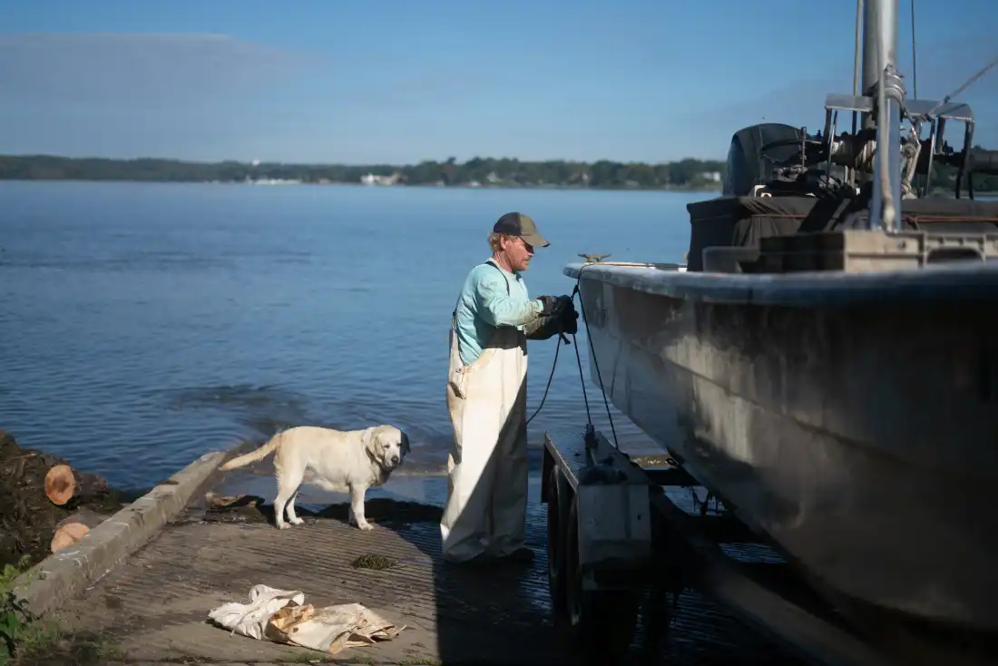 Rice secures his boat before heading back to his fish house in Maryland.