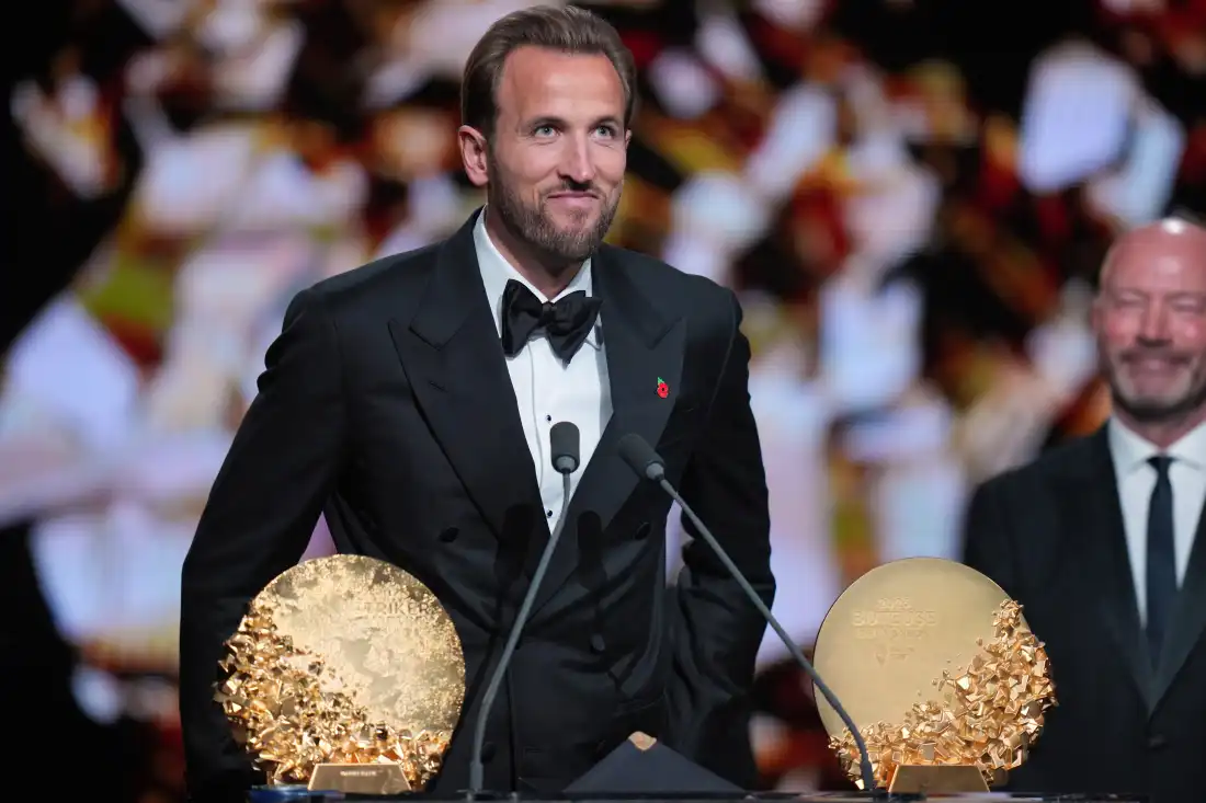 England's soccer player Harry Kane wins the trophy for striker of the year during the Ballon d'Or ceremony at the London Palladium Theatre in London, England, Monday, Oct. 26, 2026 .