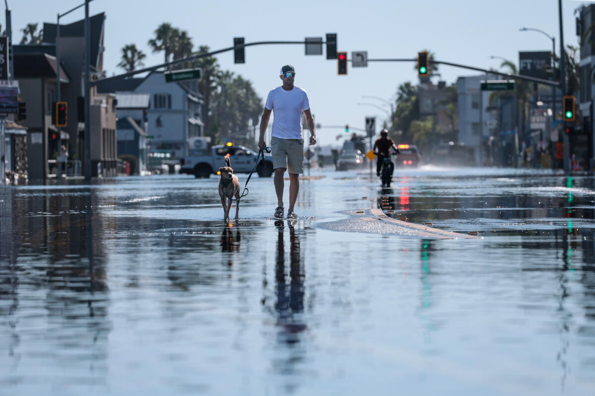 High tide floods businesses and homes along Pacific Coast Highway at Sunset Beach.