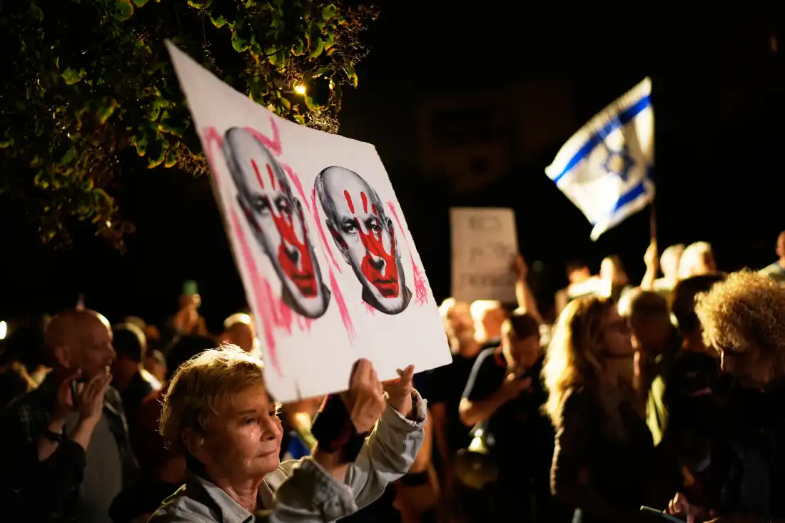 Israeli left-wing activists call for a government with Arab parties outside Yashar party leader Gadi Eisenkot's residence in Herzliya, Israel, Thursday.