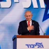 Israeli Prime Minister Benjamin Netanyahu gestures as he speaks to supporters at Likud party headquarters in Jerusalem following the release of the first exit poll results in Israel's general election, Wednesday, Oct. 28, 2026.