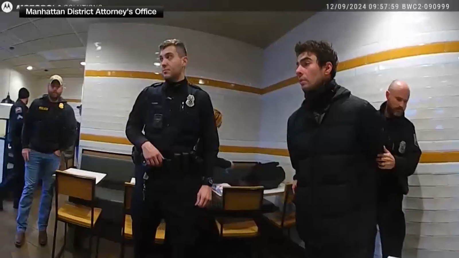 Newly released video shows Luigi Mangione arrest, evidence search