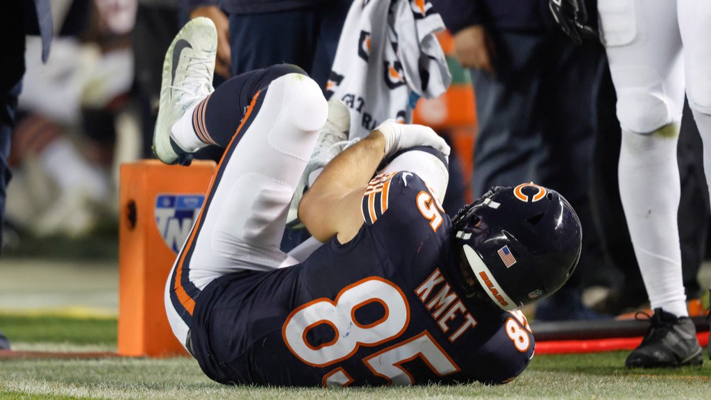 Chicago Bears tight end Cole Kmet grabs his knee after getting tackled by the New England Patriots.