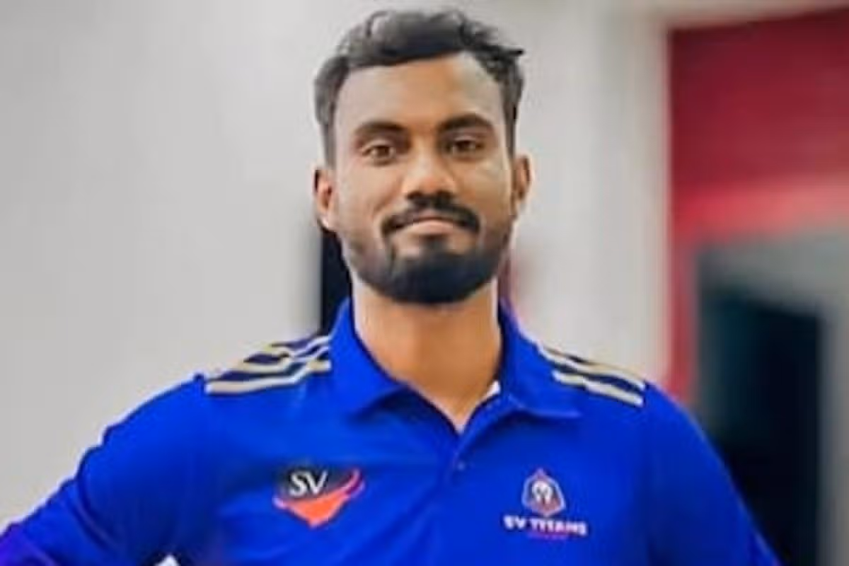 A man in a blue shirt.