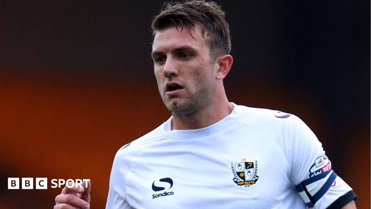 Doug Loft wearing a white Port Vale shirt