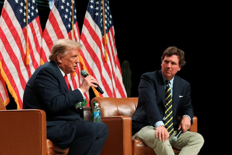 Republican presidential nominee Donald Trump participates in a fireside chat with media host Tucker Carlson at the Desert Diamond Arena, in Glendale, Arizona, the US, October 31, 2024
