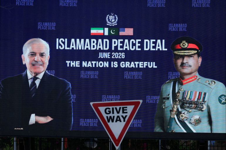 A roadside billboard displaying portraits of Pakistan's Chief of Army Staff Field Marshal Asim Munir and Prime Minister Shehbaz Sharif, following a deal between the U.S. and Iran, in Islamabad, Pakistan, June 16, 2026. REUTERS/Akhtar Soomro REFILE - CORRECTING INFORMATION FROM "GENERAL ASIM MUNIR" TO "FIELD MARSHAL ASIM MUNIR".