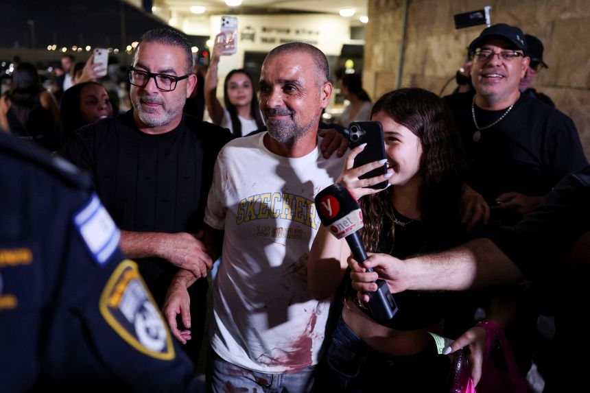 Yaniv Hayun, one of the men who helped incapacitate the attacker on the FlyDubai aircraft bound for Israel from the United Arab Emirates reacts after arriving at the Ben Gurion International Airport, Israel, September 30.