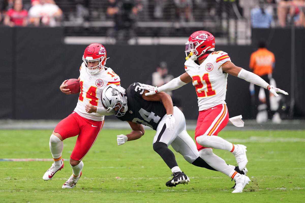Kansas City Chiefs punter Matt Araiza (14) runs the ball on a fake as Las Vegas Raiders fullback Connor Heyward (34) gives chase during a Week 4 NFL game at Allegiant Stadium in Paradise, Nevada on Sunday, Oct. 4, 2026.