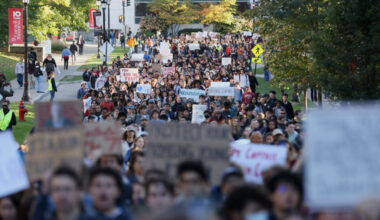 People attend a Justice for Survivors rally on at Cornell University in Ithaca, New York