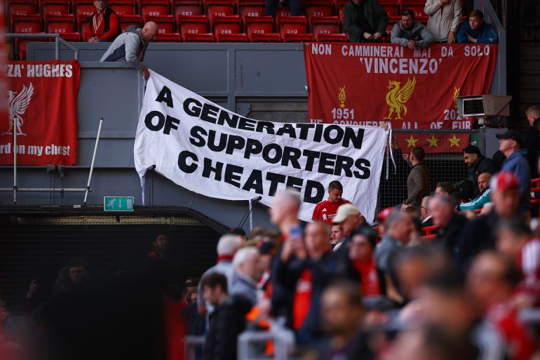 Soccer Football - Premier League - Liverpool v Manchester City - Anfield, Liverpool, Britain - October 11, 2026 Liverpool fans with a banner related to the Manchester City's Premier League charges inside the stadium before the match REUTERS/Phil Noble EDITORIAL USE ONLY. NO USE WITH UNAUTHORIZED AUDIO, VIDEO, DATA, FIXTURE LISTS, CLUB/LEAGUE LOGOS OR 'LIVE' SERVICES. ONLINE IN-MATCH USE LIMITED TO 120 IMAGES, NO VIDEO EMULATION. NO USE IN BETTING, GAMES OR SINGLE CLUB/LEAGUE/PLAYER PUBLICATIONS. PLEASE CONTACT YOUR ACCOUNT REPRESENTATIVE FOR FURTHER DETAILS..