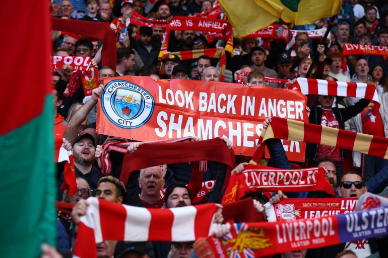 Soccer Football - Premier League - Liverpool v Manchester City - Anfield, Liverpool, Britain - October 11, 2026 Liverpool fans with a banner related to the Manchester City's Premier League charges inside the stadium before the match REUTERS/Phil Noble EDITORIAL USE ONLY. NO USE WITH UNAUTHORIZED AUDIO, VIDEO, DATA, FIXTURE LISTS, CLUB/LEAGUE LOGOS OR 'LIVE' SERVICES. ONLINE IN-MATCH USE LIMITED TO 120 IMAGES, NO VIDEO EMULATION. NO USE IN BETTING, GAMES OR SINGLE CLUB/LEAGUE/PLAYER PUBLICATIONS. PLEASE CONTACT YOUR ACCOUNT REPRESENTATIVE FOR FURTHER DETAILS..