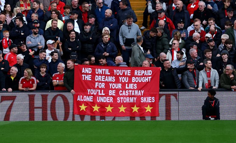 Soccer Football - Premier League - Liverpool v Manchester City - Anfield, Liverpool, Britain - October 11, 2026 Liverpool fans with a banner related to the Manchester City's Premier League charges inside the stadium before the match REUTERS/Phil Noble EDITORIAL USE ONLY. NO USE WITH UNAUTHORIZED AUDIO, VIDEO, DATA, FIXTURE LISTS, CLUB/LEAGUE LOGOS OR 'LIVE' SERVICES. ONLINE IN-MATCH USE LIMITED TO 120 IMAGES, NO VIDEO EMULATION. NO USE IN BETTING, GAMES OR SINGLE CLUB/LEAGUE/PLAYER PUBLICATIONS. PLEASE CONTACT YOUR ACCOUNT REPRESENTATIVE FOR FURTHER DETAILS..