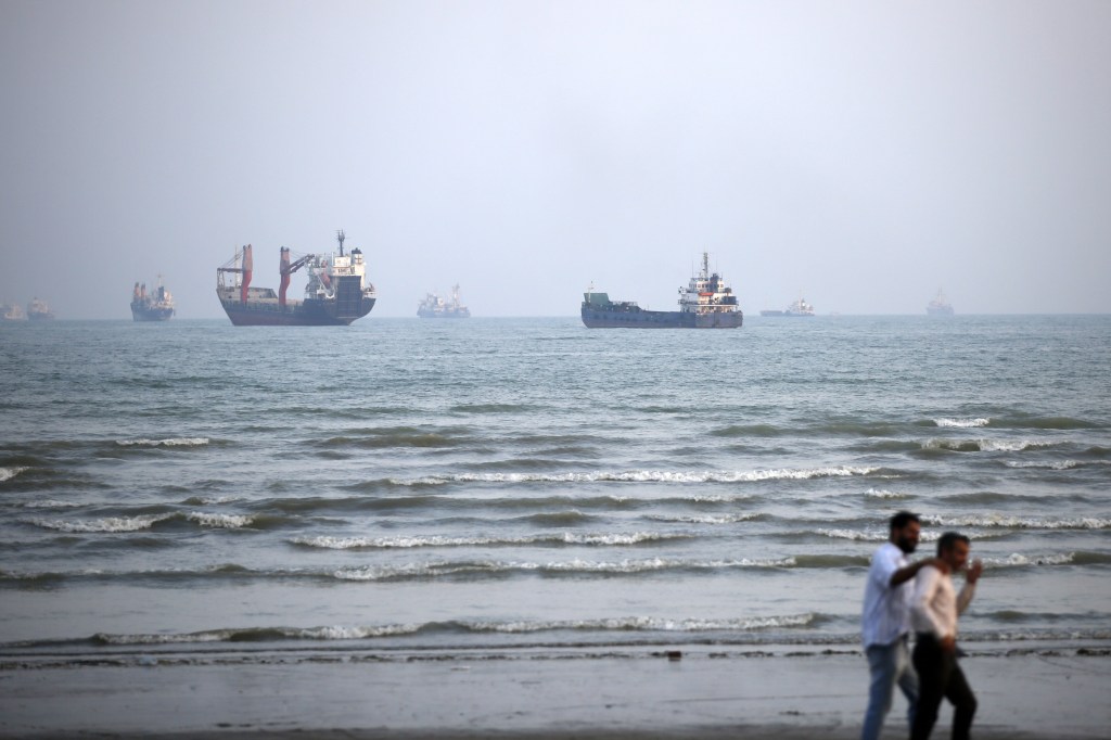 Numerous merchant ships at anchor in the Strait of Hormuz in Bandar Abbas, Iran.