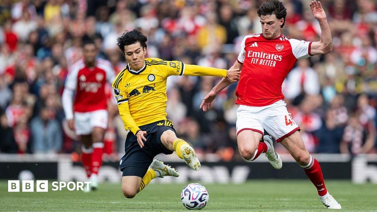 Tanaka and Rice battle for the ball.