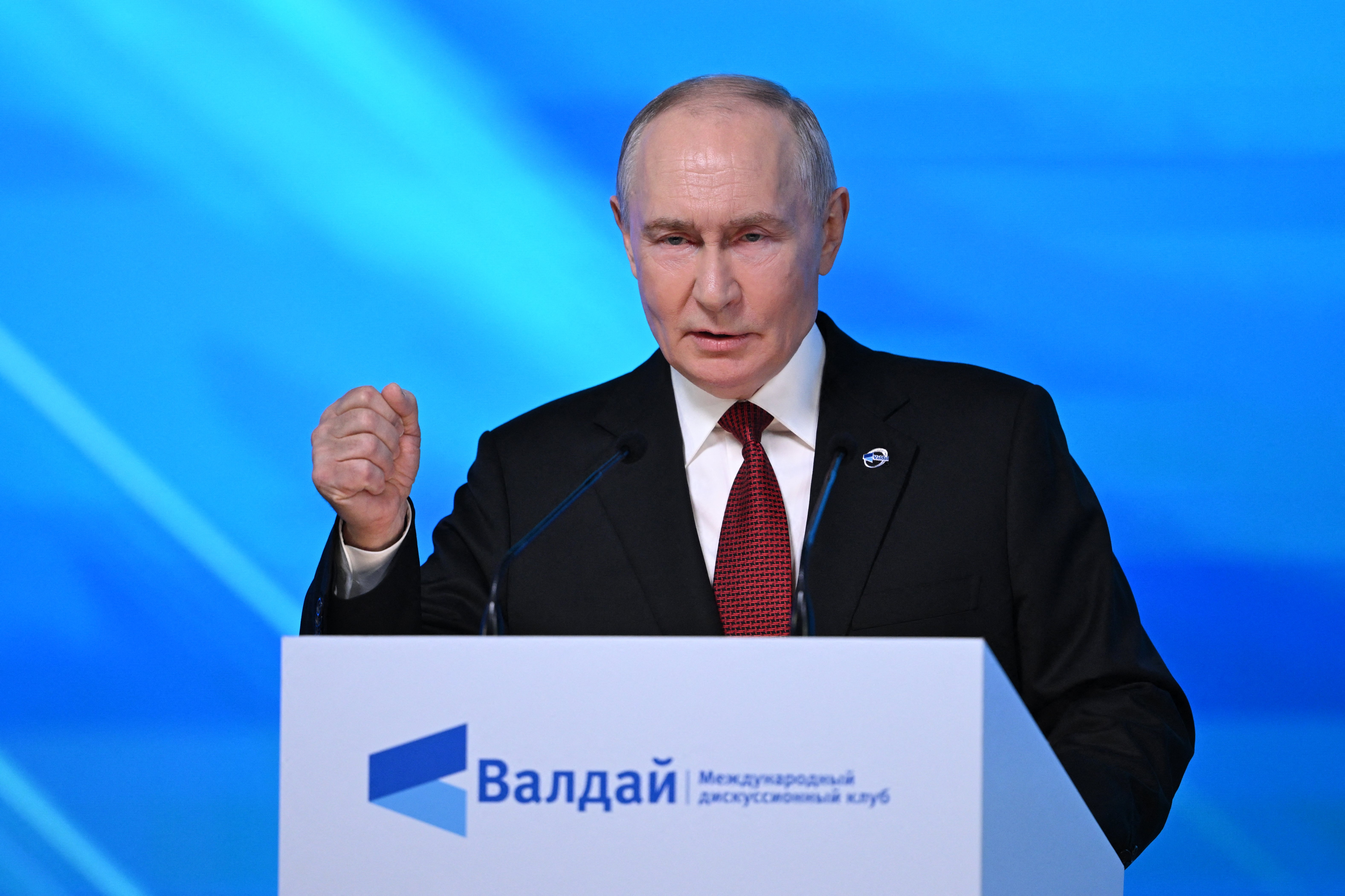 Russia's President Vladimir Putin gestures as he addresses the audience during the Valdai Discussion Club meeting in Moscow on October 1