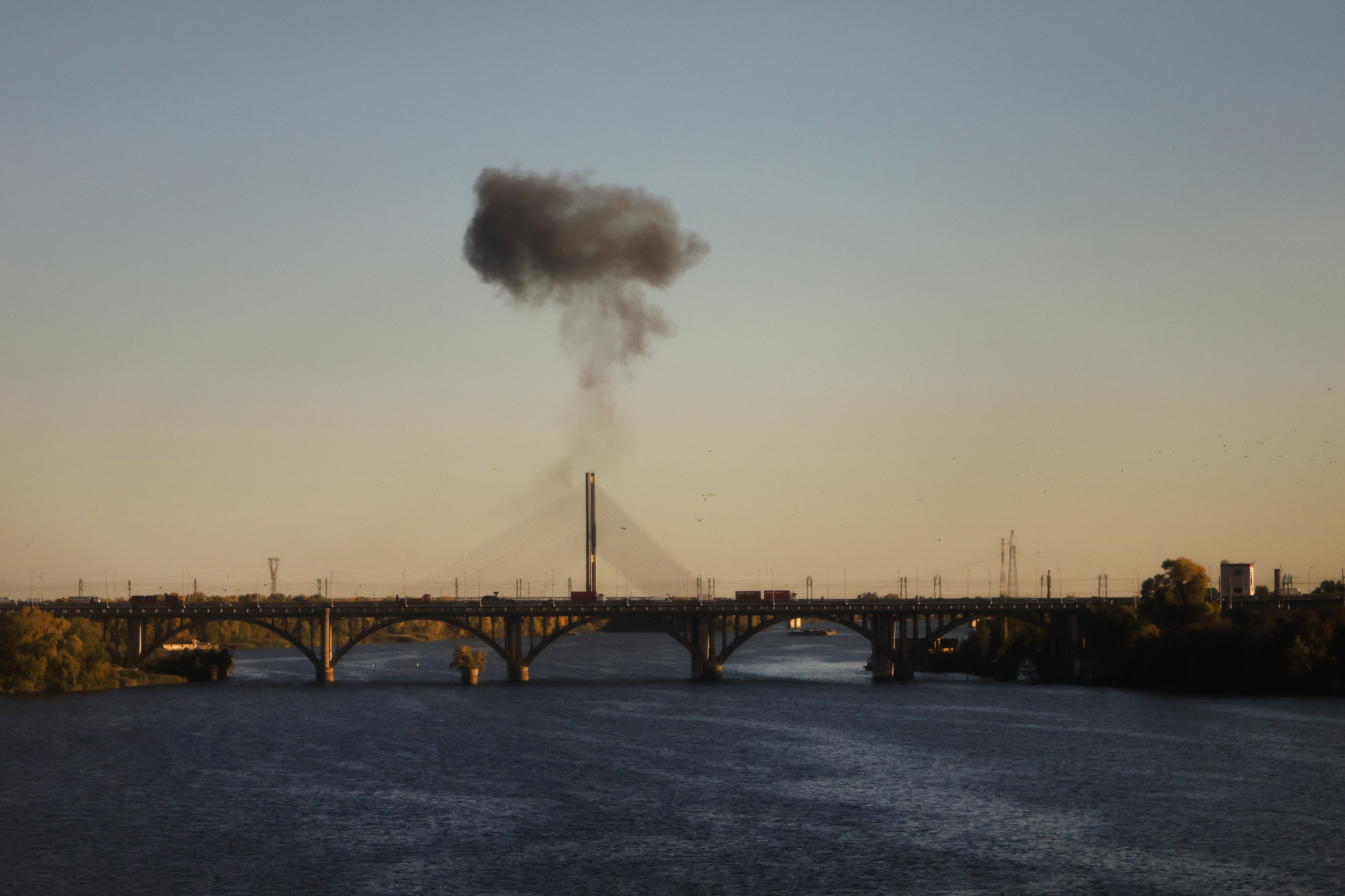 Smoke rises over a bridge spanning the Dnieper River following a drone attack in Kyiv on 2 October 2026, amid the Russian invasion of Ukraine