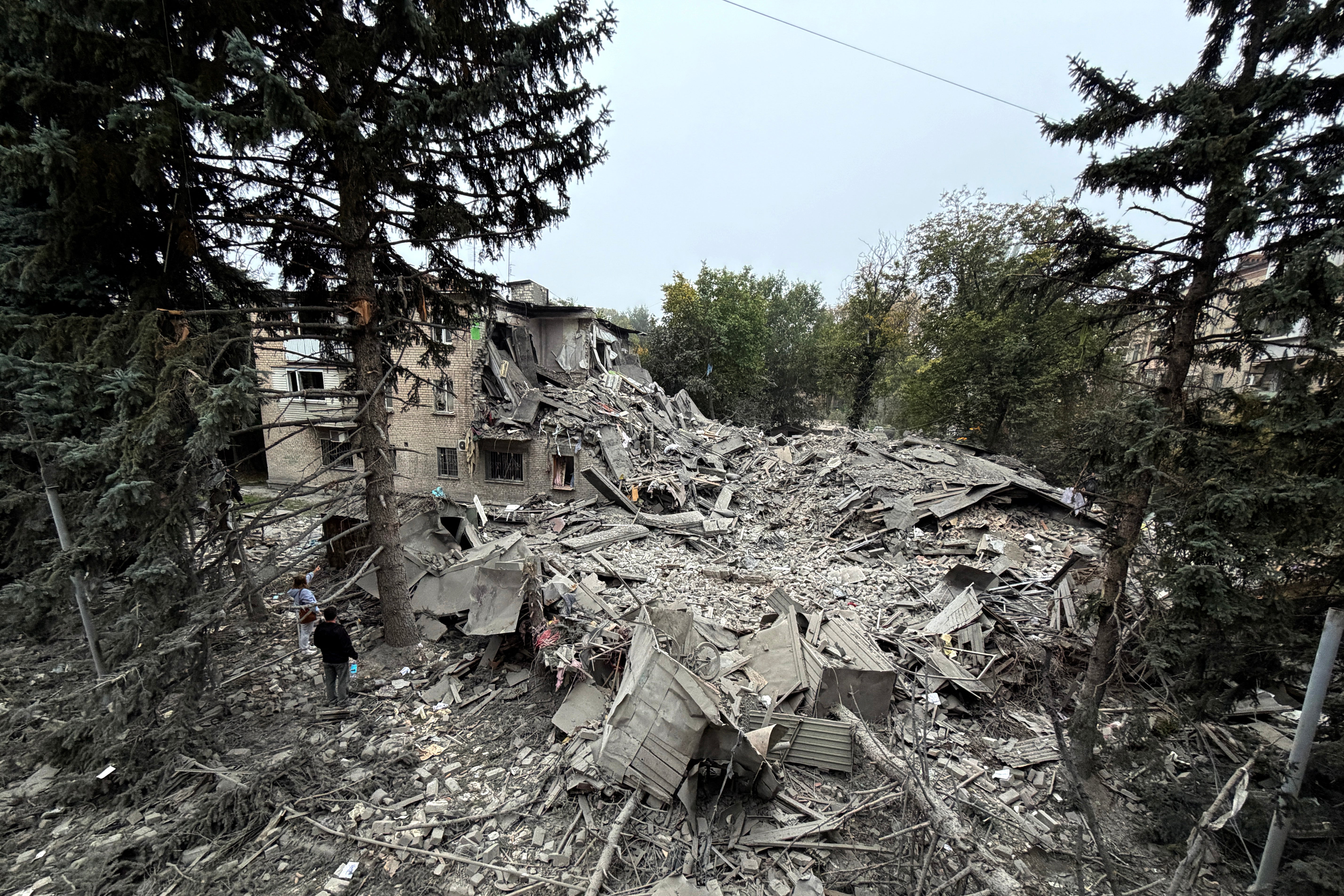 Rubble lies among the ruins of buildings damaged during Russia’s war against Ukraine