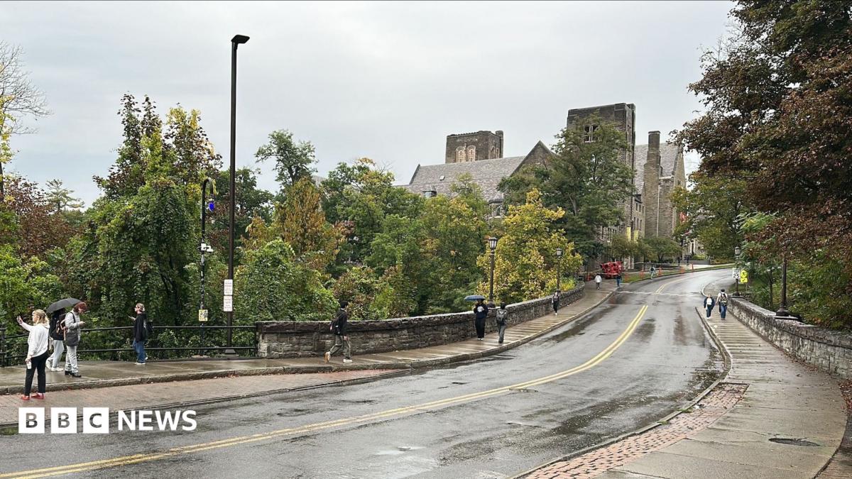 A long road towards the Cornell University campus is seen on a rainy day