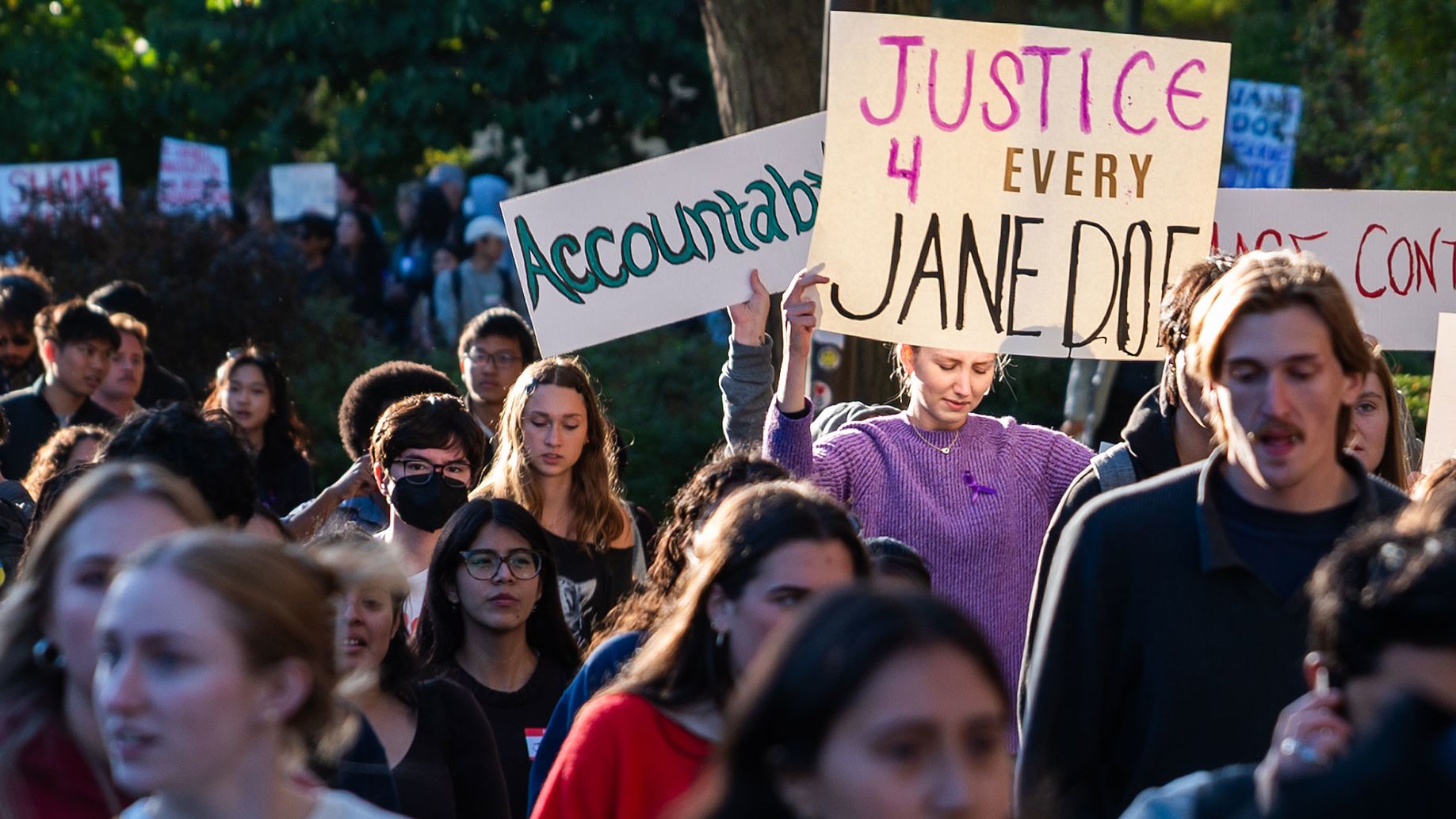 Protesters march toward Day Hall on Cornell University's campus on October 5, 2026, in Ithaca, New York.