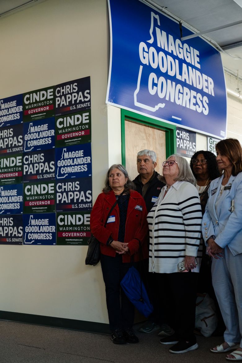People listen to Sen. Raphael Warnock during a meet-and-greet event with Chris Pappas in Nashua, New Hampshire, on October 6.