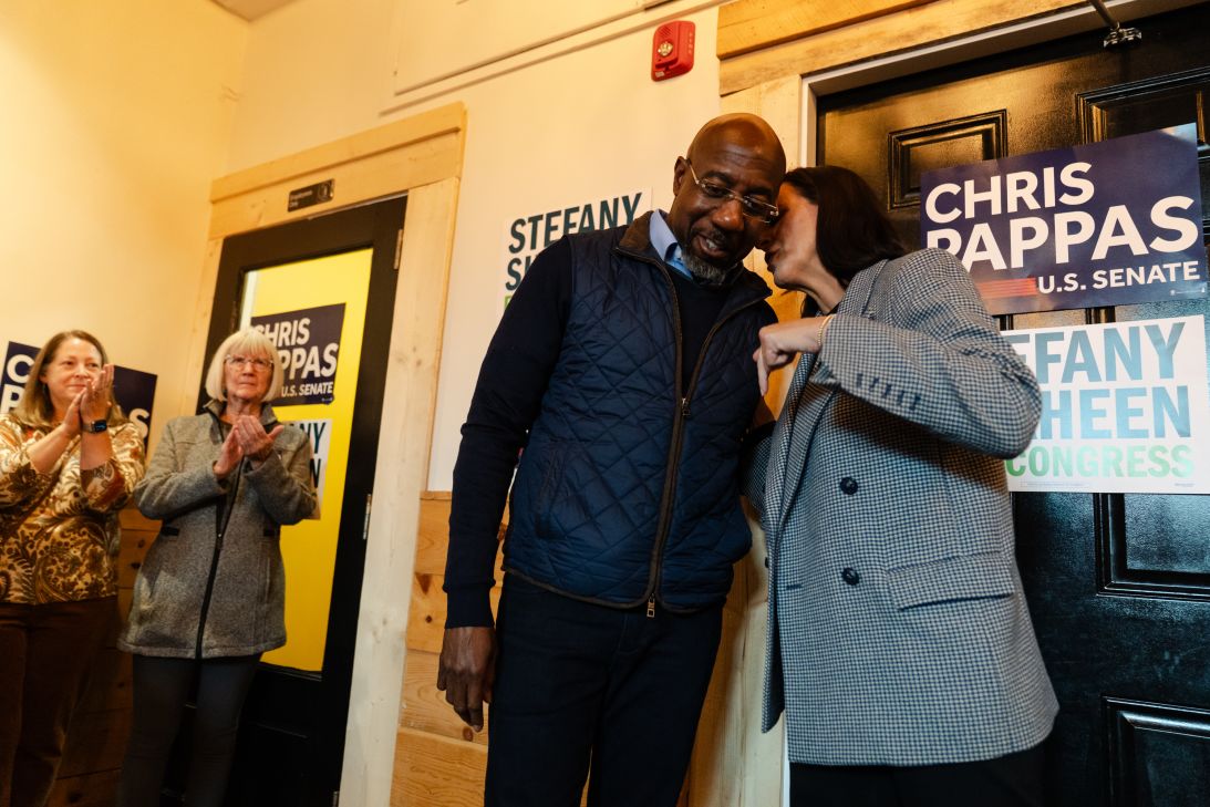 Sen. Raphael Warnock and House candidate Stefany Shaheen speak during a meet-and-greet in Portsmouth, New Hampshire, on October 6.
